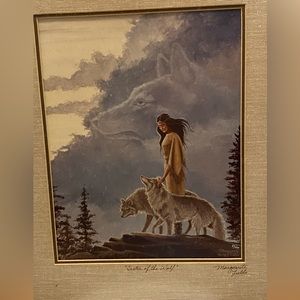 Framed signed artwork.